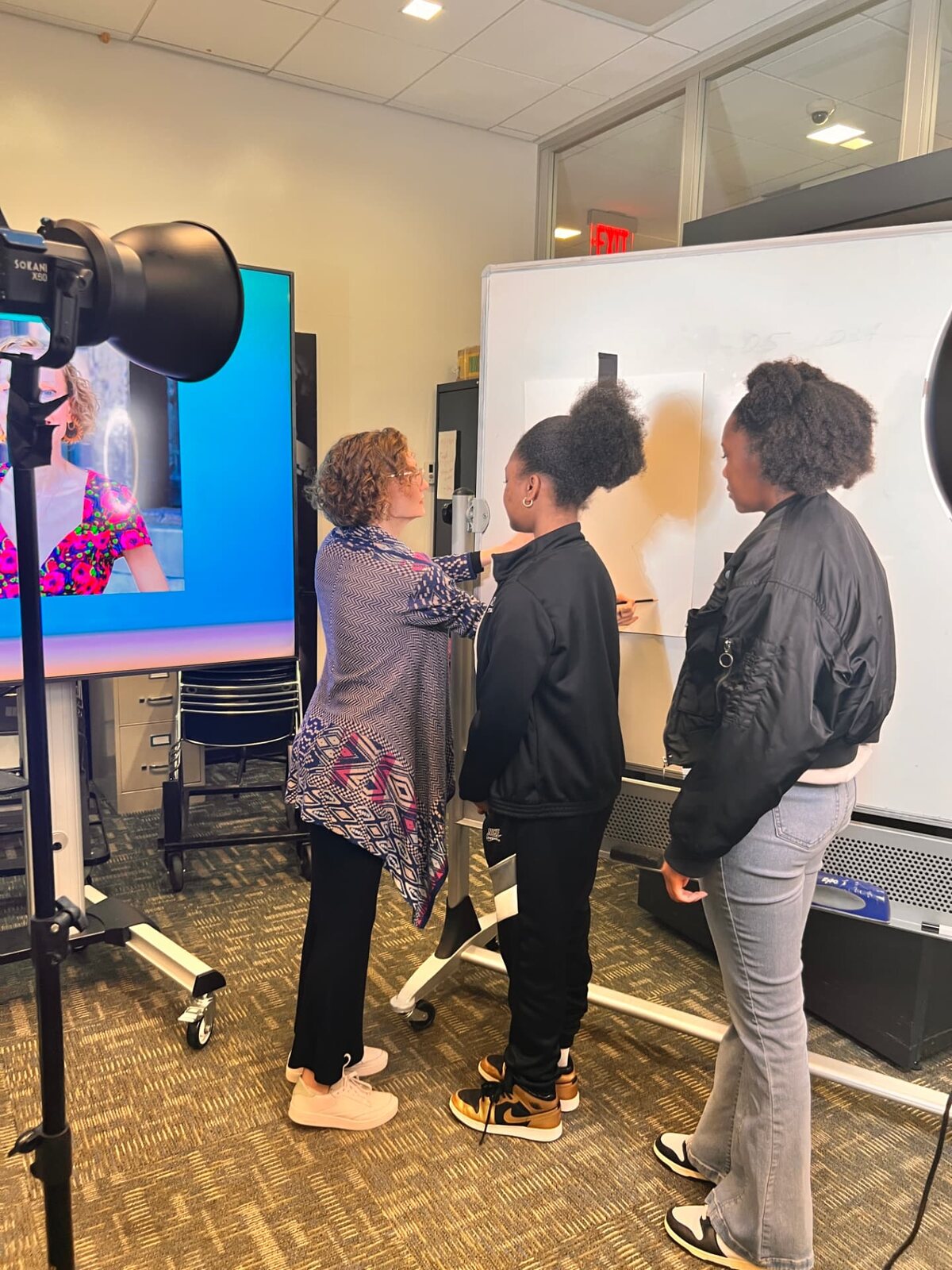 Setting up the shot at the whiteboard