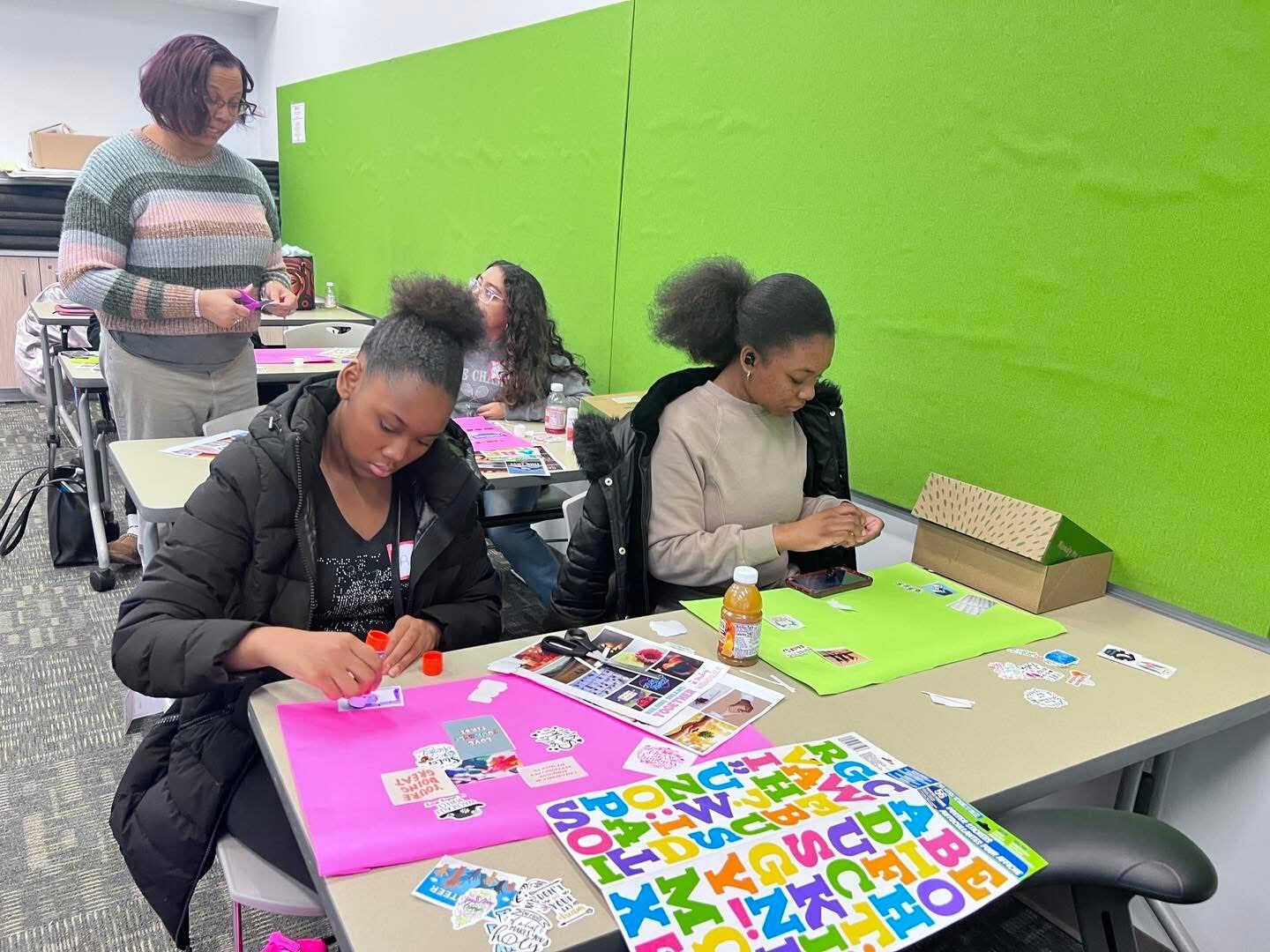 Crafting vision boards with stickers and letters