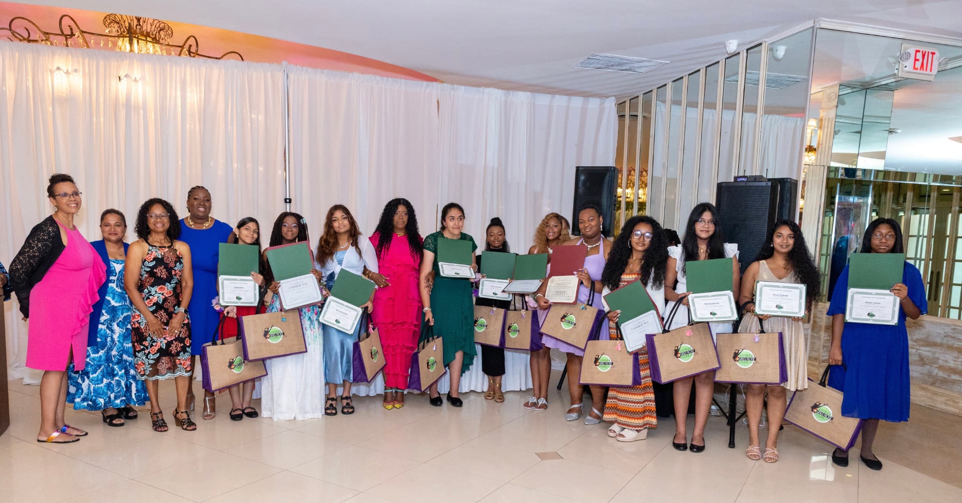 The group gathers with certificates at the scholarship luncheon