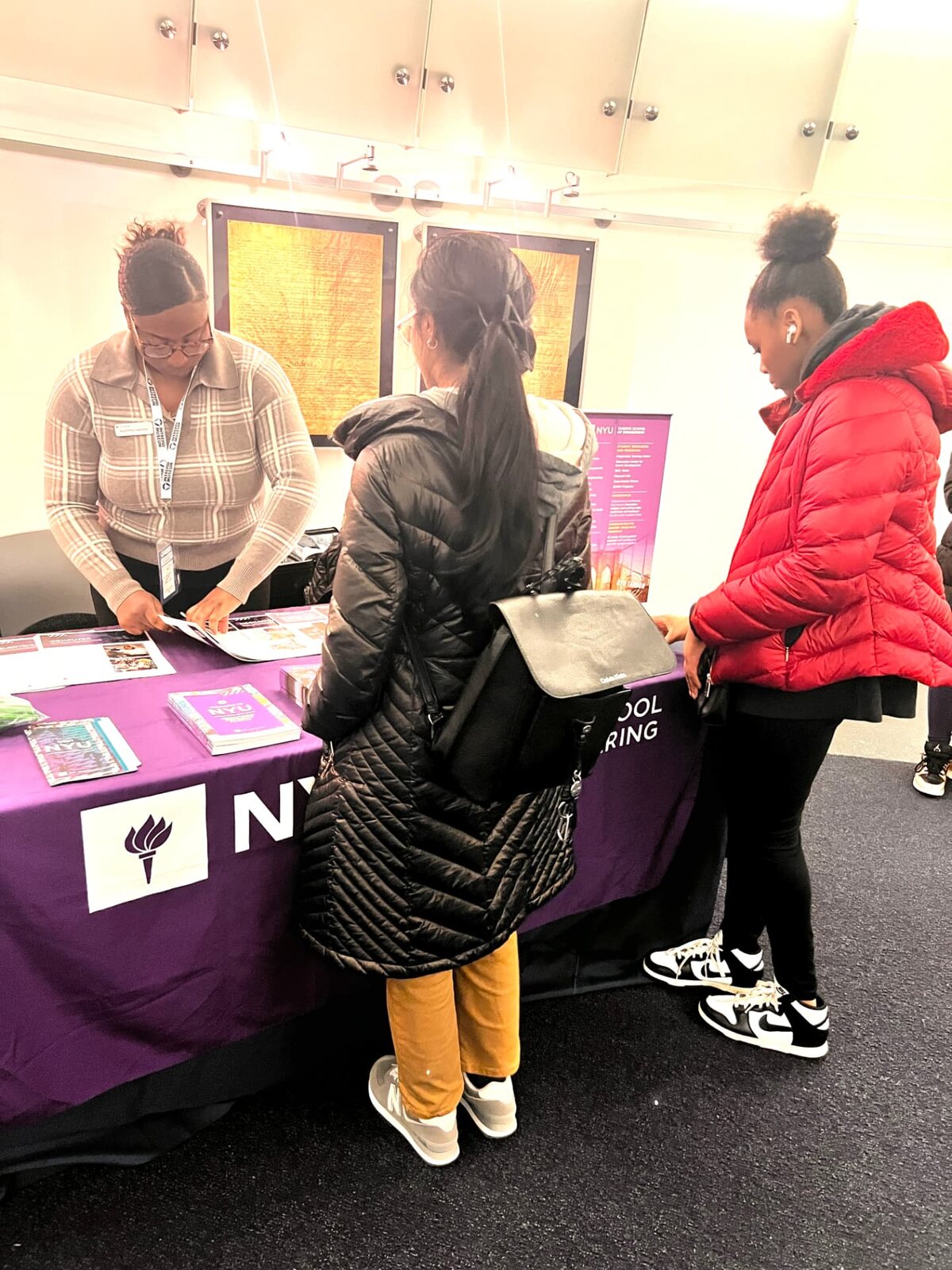 Exploring college options at an NYU counseling table