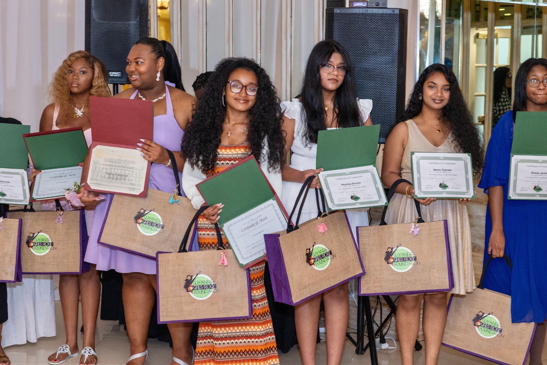 Scholars with certificates and bags at the scholarship luncheon