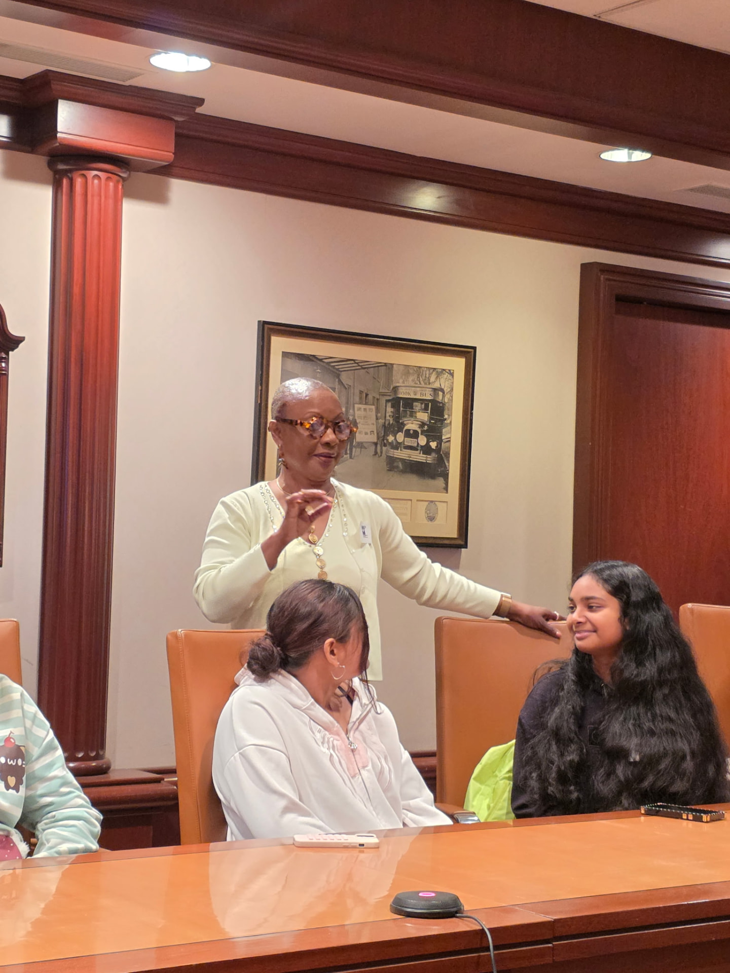 A conversation with scholars around the meeting table